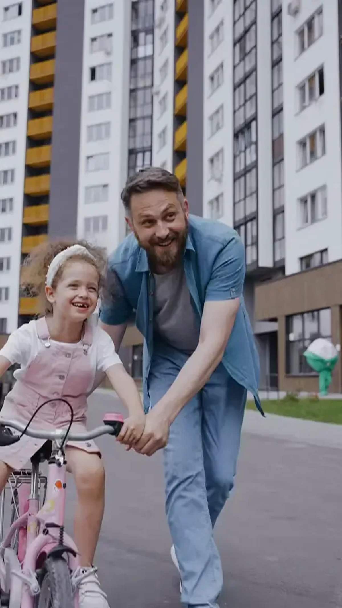 A father and child riding bikes