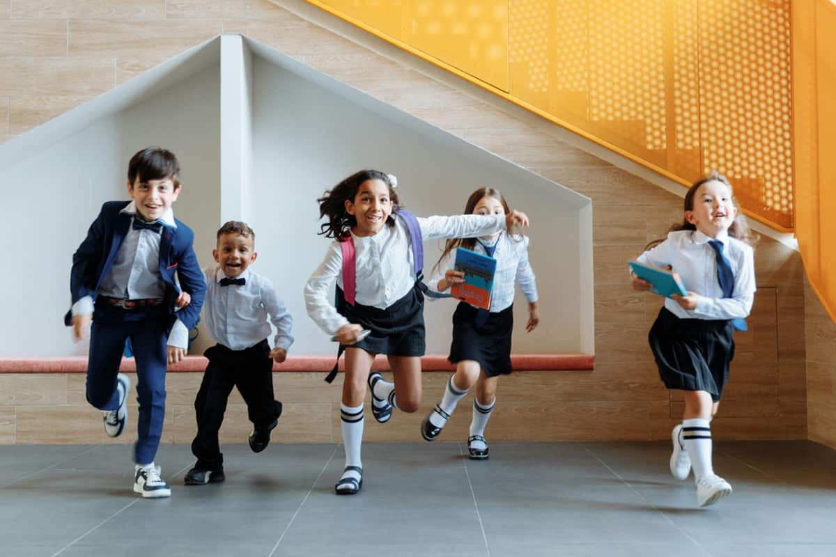 Students running together outdoors