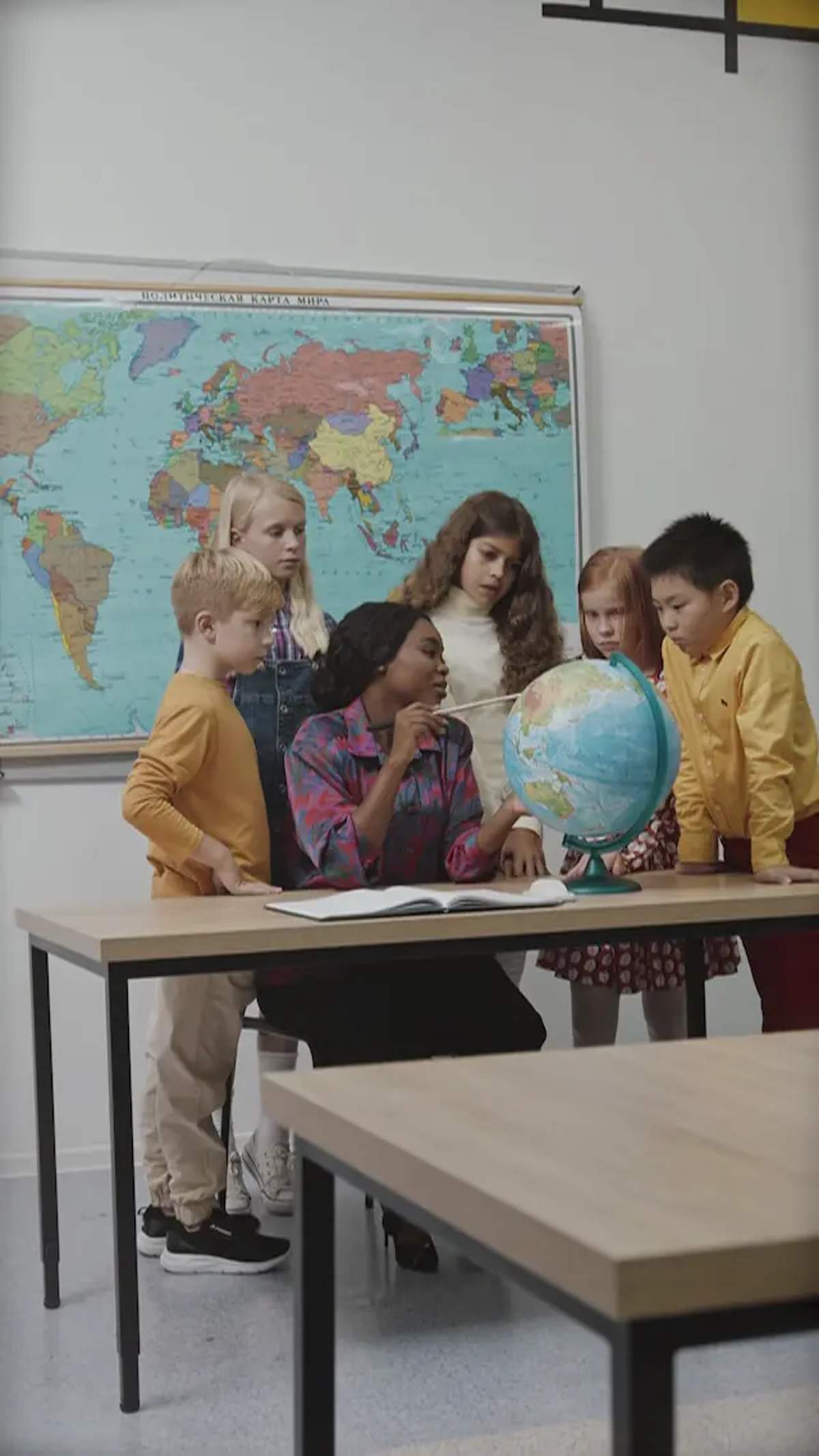 A teacher with a globe